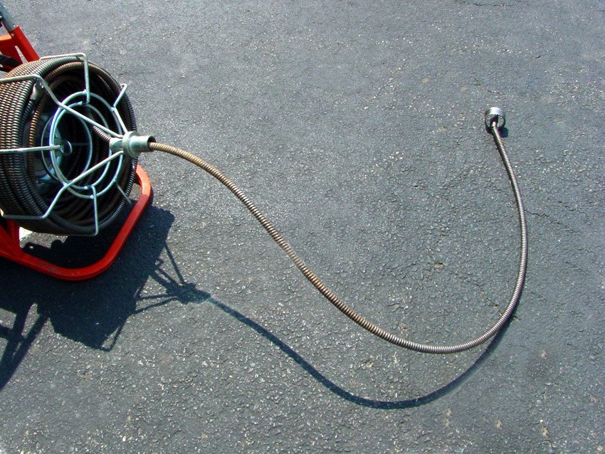Plumbing snake and drain cleaning equipment